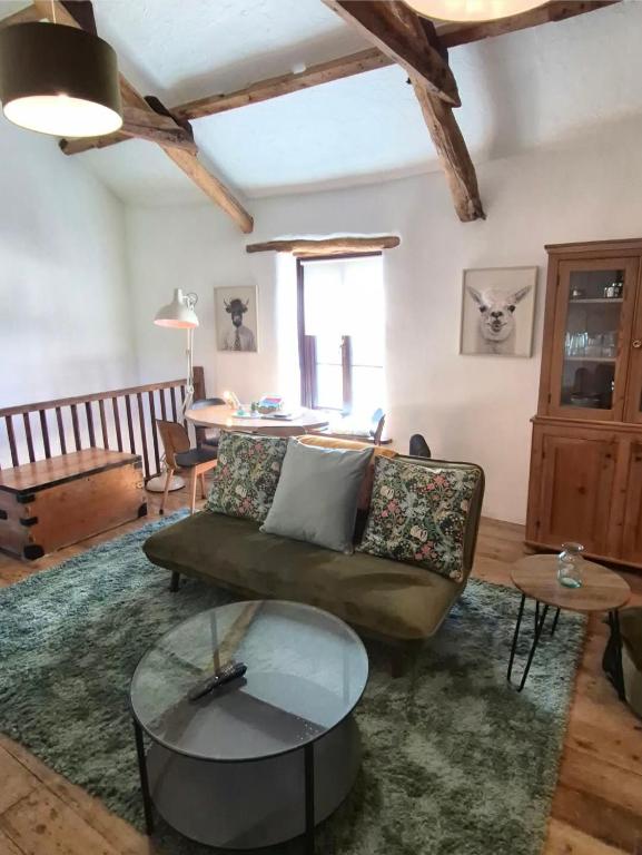 a living room with a couch and a table at Dean Linhay in Lynton
