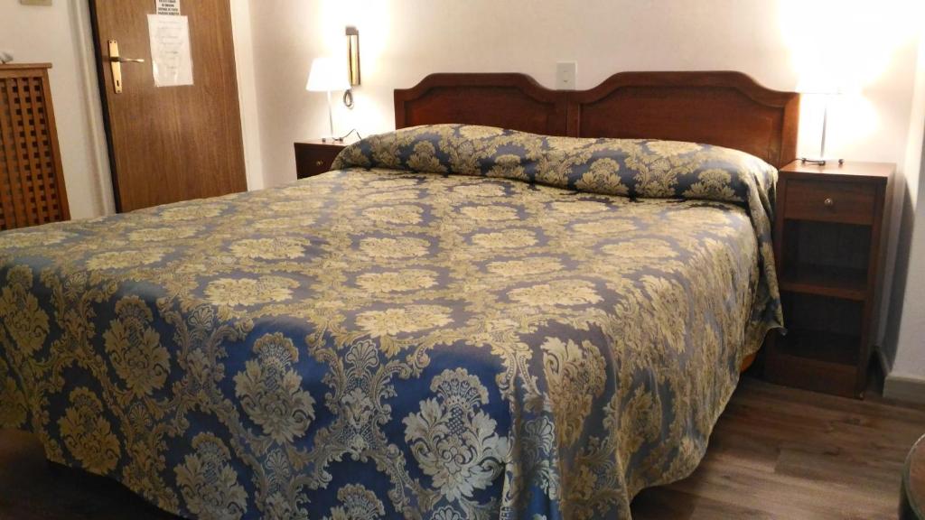 Postel nebo postele na pokoji v ubytování Albergo Casa Peron