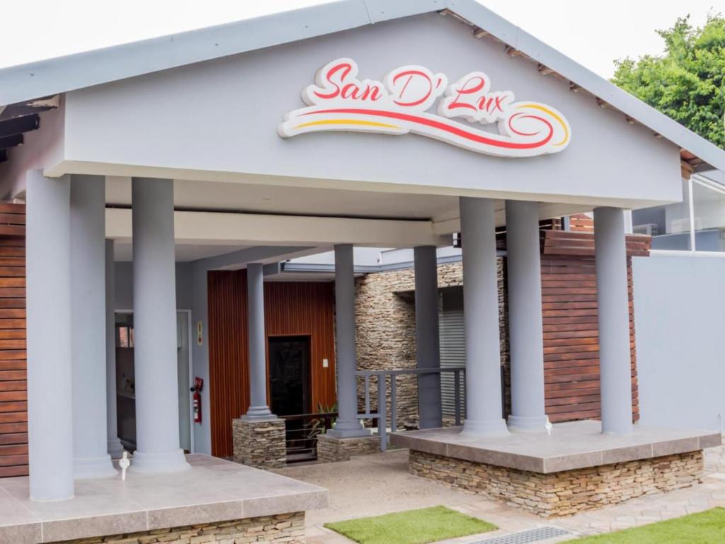 a building with a sign on top of it at San D- Lux Boutique Hotel in Durban