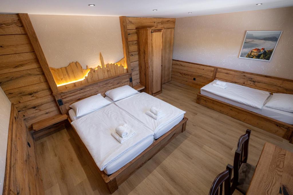an overhead view of a bedroom with two beds at Bed & Breakfast LakeBled House in Bled