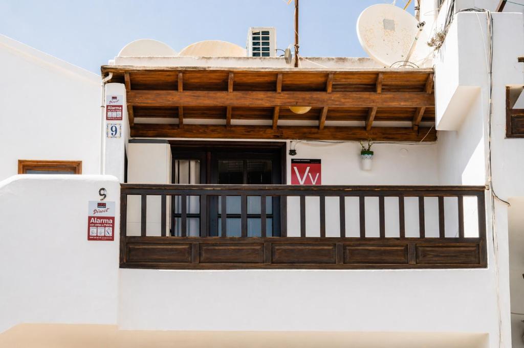a view from the outside of a house with a wooden door at Apartamento Alba Lanzarote in Puerto del Carmen