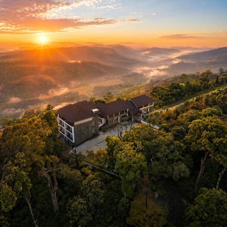 an aerial view of a house in the middle of a forest at Olive Woods in Chinnakanal