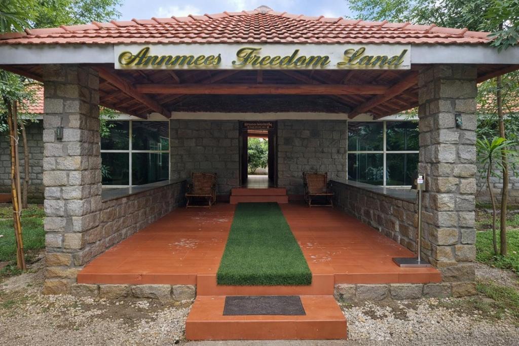 a gazebo with a sign that reads summer kitchen land at Annmees Freedom Land in Bangalore
