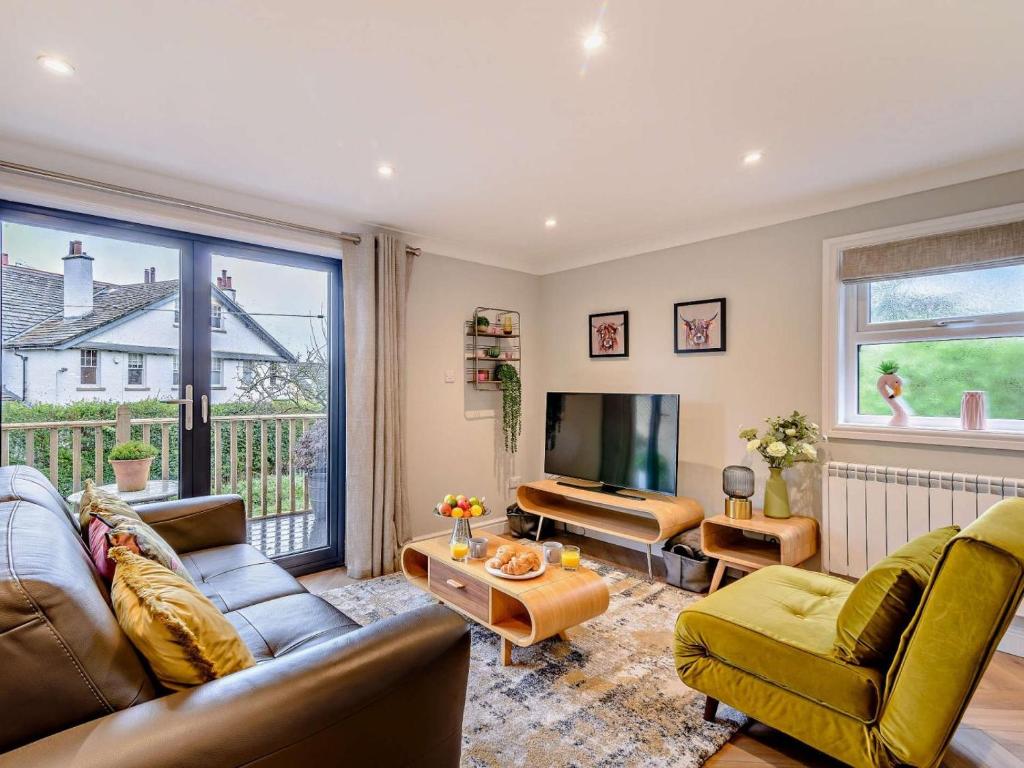 a living room with a couch and a television at 1 Bed in Ilkley oc-87569 in Ilkley