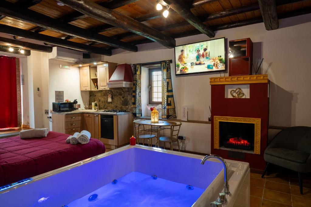 a living room with a tub in the middle of a room at Golden House in Bracciano