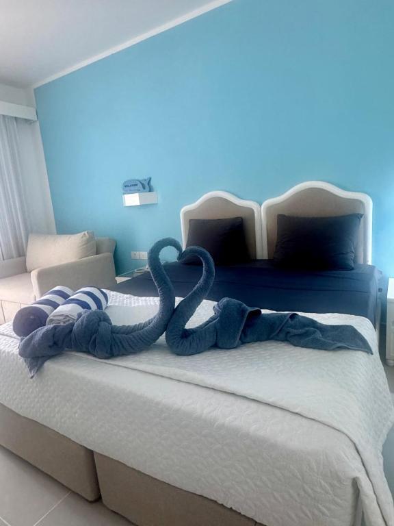 a bed with two snakes laying on top of it at MDS Coral Bay Pearl Sea View Resort in Sharm El Sheikh