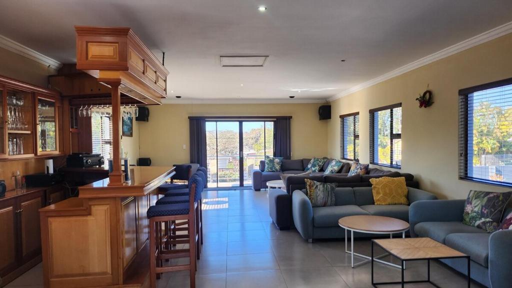 a living room with a couch and a table at Ntobongwana in Pinetown
