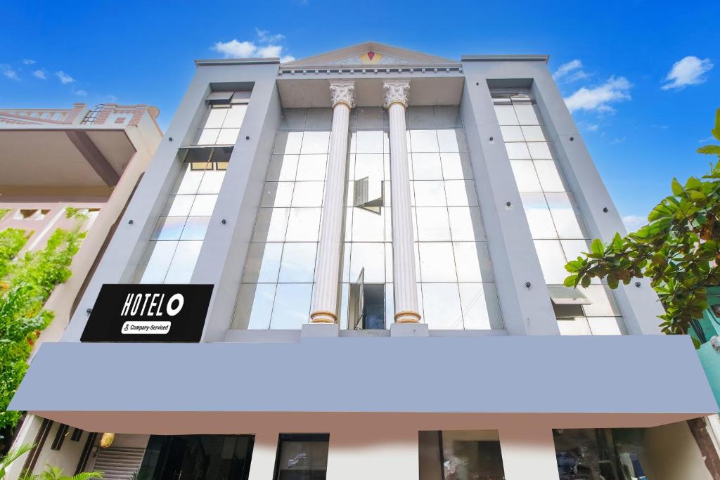a building with a sign on the front of it at OYO Hotel O Gurudwara Near RTC Complex in Visakhapatnam