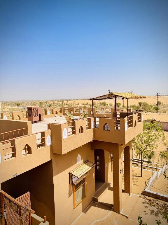 an aerial view of a building in the desert at VVIP Gajban Resort & Desert Stay, Bikaner in Bikaner
