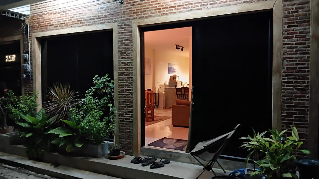 a large mirror in a room with plants at The Town House in Pai