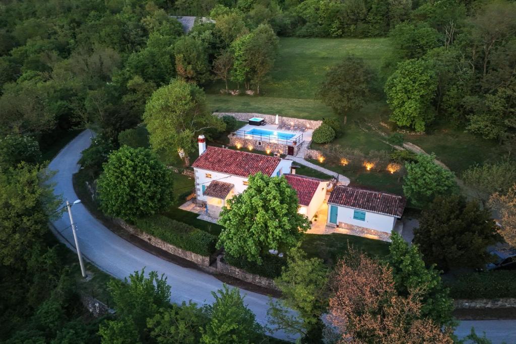 an aerial view of a house with a driveway at Villa Rocco in Kozljak