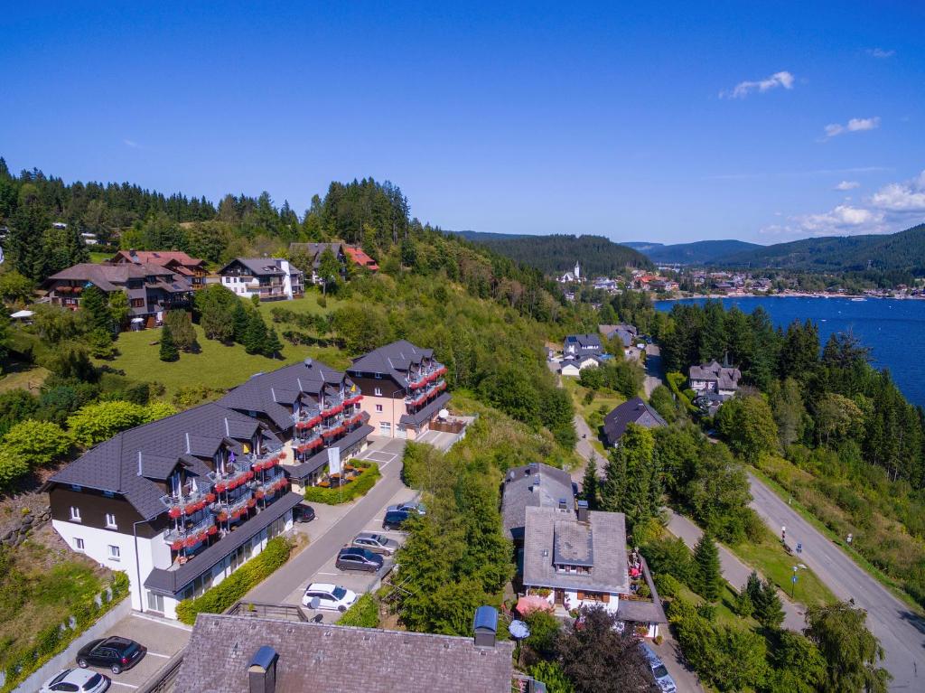 an aerial view of a town on a hill at NATURE TITISEE - Easy.Life.Hotel. in Titisee-Neustadt