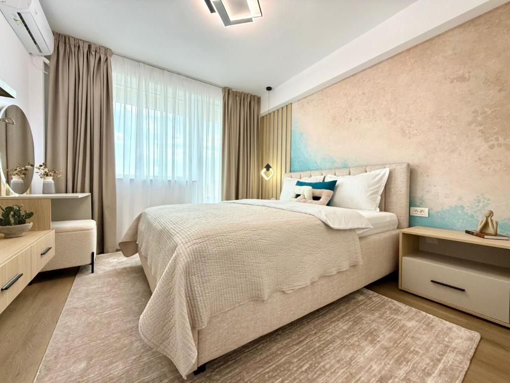 a bedroom with a large bed and a window at Central View Apartment in Timişoara