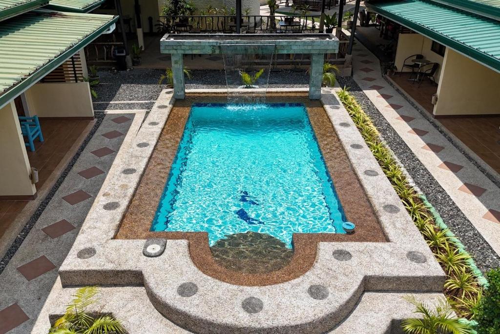 an overhead view of a swimming pool in a building at Midnite Inn in Panglao Island