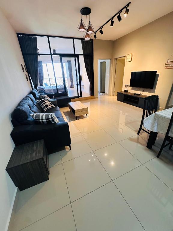 a large living room with a couch and a piano at Sungai palas Horizon in Cameron Highlands