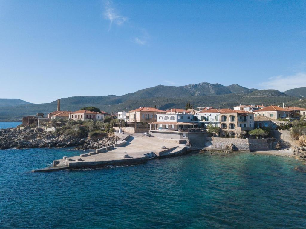 a group of houses on a small island in the water at Gorgones, sea-front, great view in Kardamyli