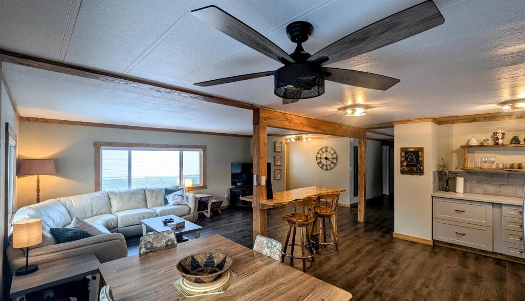 a living room with a couch and a ceiling fan at Hillcrest Hideaway Spacious Mountain View Oasis in Hillcrest Mines