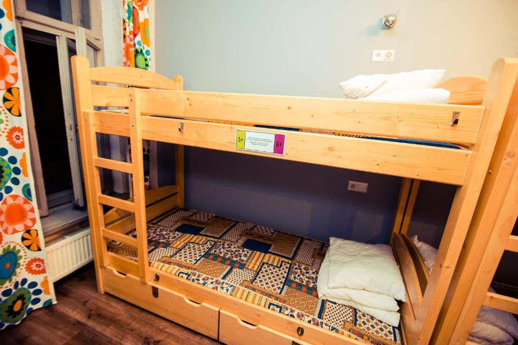 a couple of bunk beds in a room at Greg&Tom Beer House Hostel in Krakow
