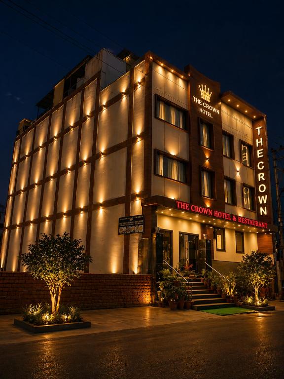 a building with lights on the front of it at The Crown Hotel Agra near Taj Mahal in Agra
