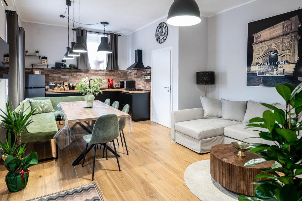 a living room with a table and a couch at Fioretti Home in San Giorgio Montagna