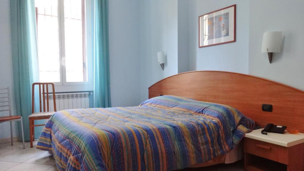 Posteľ alebo postele v izbe v ubytovaní Hotel2000