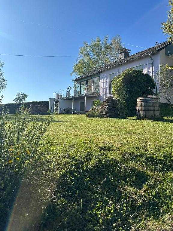a large white house with a large yard at HeartArt in Bad Münstereifel