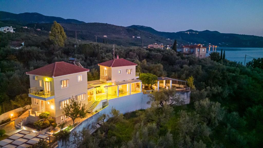 an aerial view of a house with lights at Lumaverde Estate in Kalamata