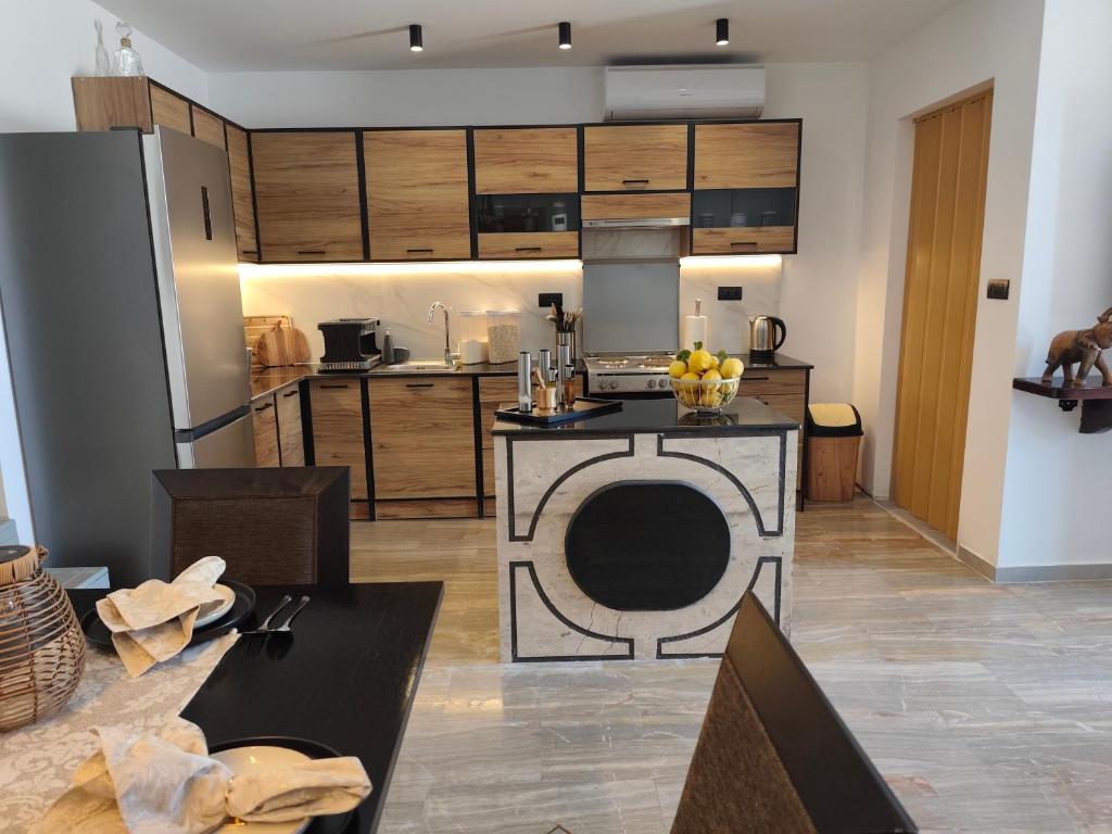 a kitchen with a stove and a counter top at Sunrise House in Kefalos