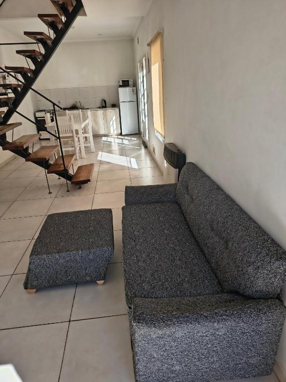 a living room with a couch and a table at Depto Civora 4 in Villa Regina
