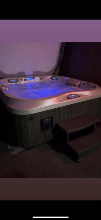 a bath tub with blue lights on top of it at Royal SPA Saarbrucken in Stiring-Wendel