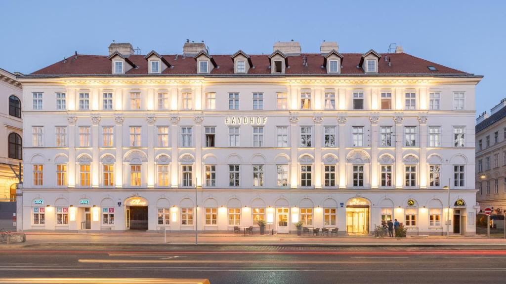 a large white building on the corner of a street at Parkview Boutique Apartments in Vienna