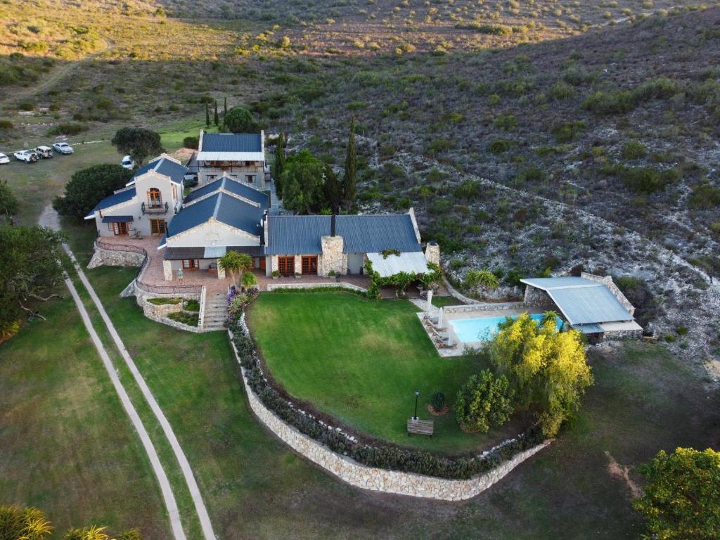 an aerial view of a house with a swimming pool at Swartklip Game Lodge in Riversdale