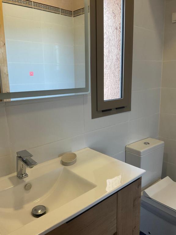 a bathroom with a sink and a toilet at DOMAINE VILLa in Tameslouht