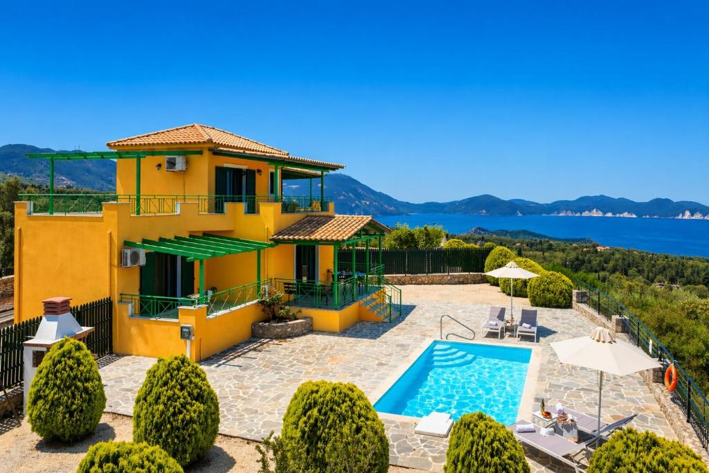 a villa with a swimming pool and a view at Villa Valio in Dhrapanítika