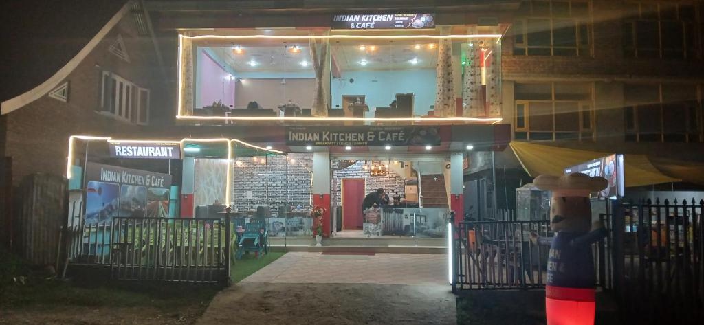 a store front at night with lights on it at Village guesthouse in Srinagar
