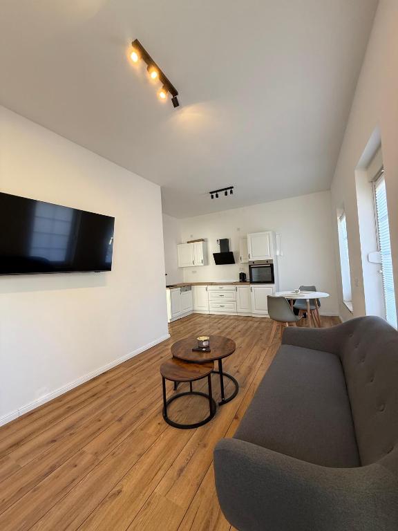 a living room with a couch and a table at MeerZeit in Kappeln