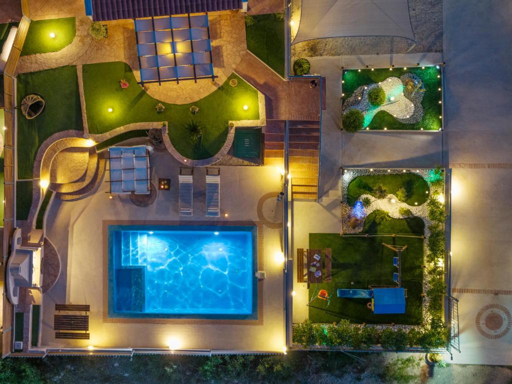 an aerial view of a resort with a swimming pool at Villa Angelo Porto Heli - Private Pool in Porto Heli