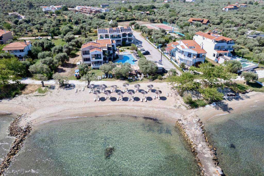 an aerial view of a beach with a resort at Aegean Sun Hotel in Skala Rachoniou
