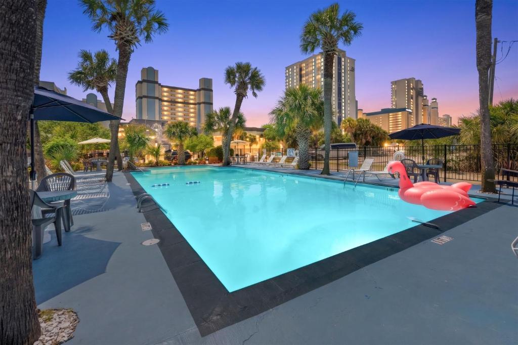a swimming pool with a pink flamingo in a resort at Sun Fun in Myrtle Beach