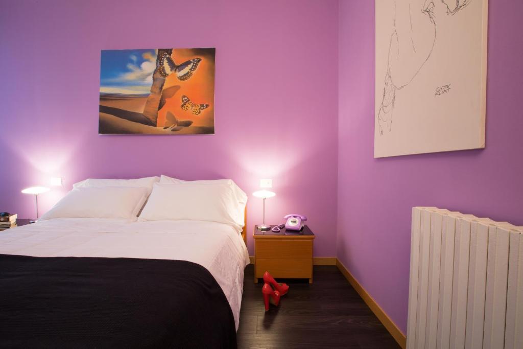 Postel nebo postele na pokoji v ubytování Albergo Giardino