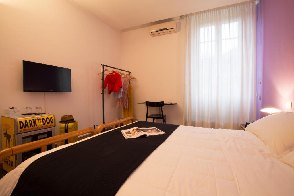 TV a/nebo společenská místnost v ubytování Albergo Giardino