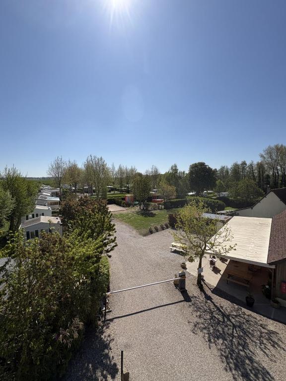 an overhead view of a park with trees and buildings at camping de la mottelette in Forest-Montiers