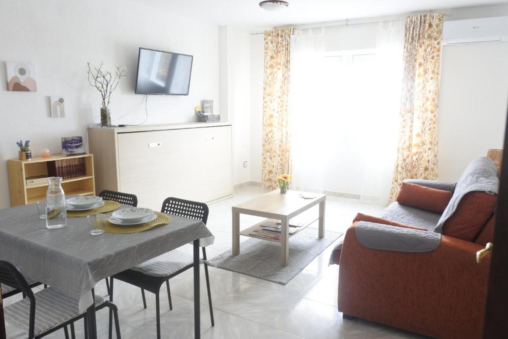 a living room with a couch and a table at Apartamento Pinilla Lagunas de Villafáfila in Manganeses de la Lampreana