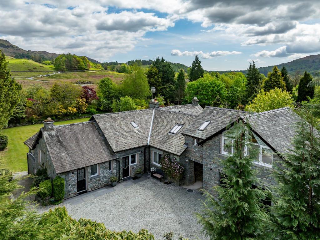 an aerial view of a house with a driveway at Fells in Chapel Stile