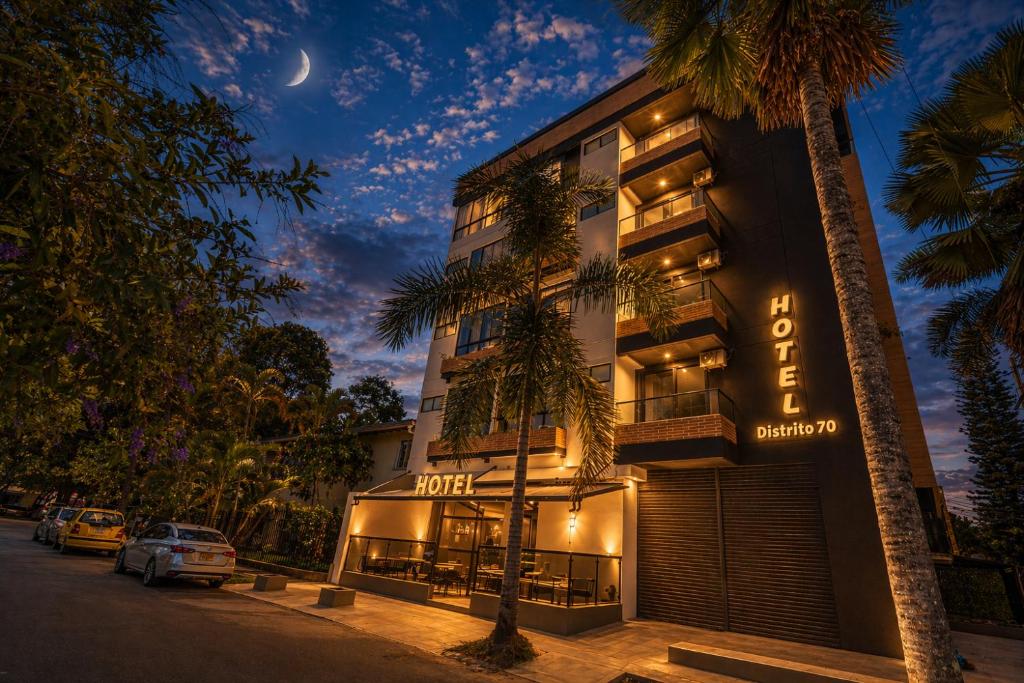 a hotel with a sign on the side of a building at Hotel Distrito 70 Living in Medellín