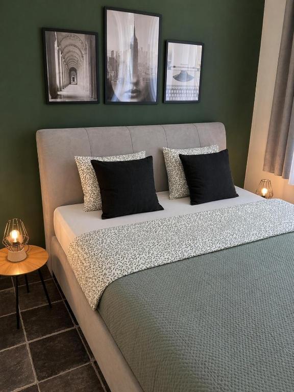 a bedroom with a bed with two pillows on it at GuestNest-Erfurt in Erfurt