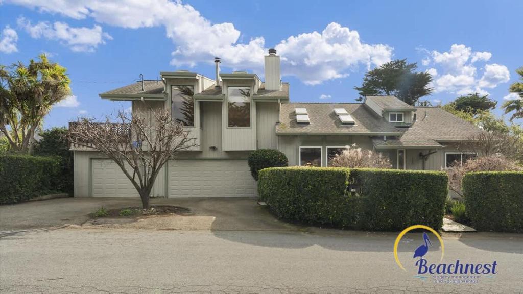 a large house with bushes in front of it at Casa Rio Del Mar in Aptos