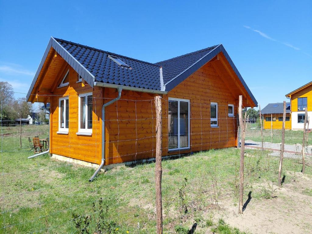 a small house is being built in a field at Ferienhaus 4 Elemente in Selchow mit tollem Garten in Selchow