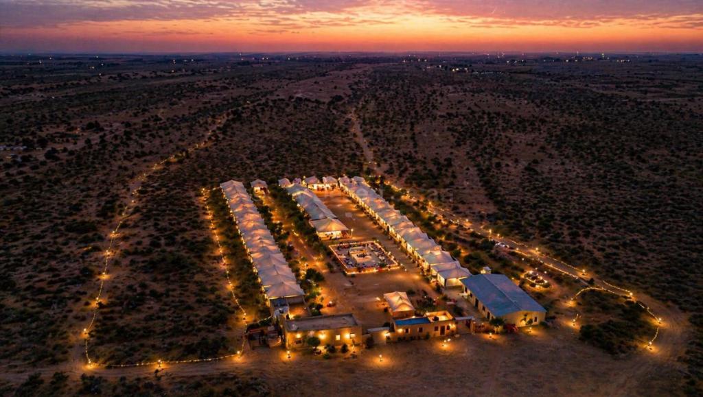 an aerial view of a parking lot at night at Sky Desert Safari With Swimming Pool in Jaisalmer