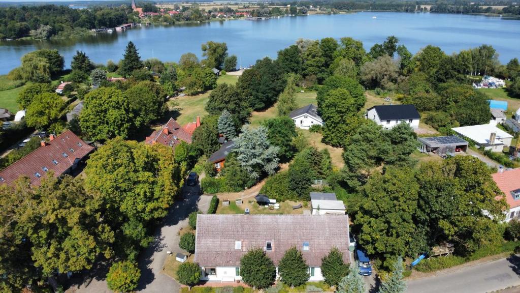 an aerial view of a house with a lake at Landdomiziel in Damerow